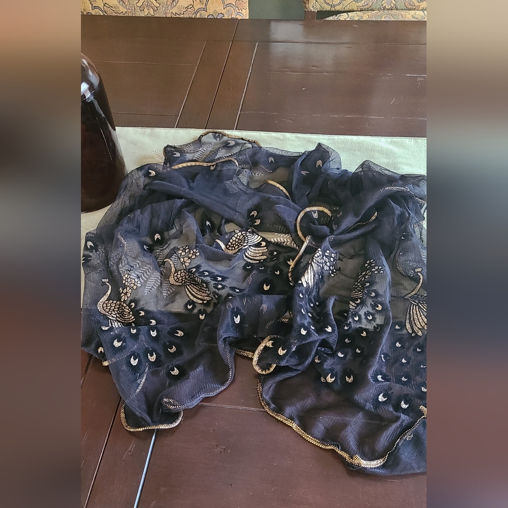 Beautiful sheer black ruffled scarf with gold stitching with a  peacock design